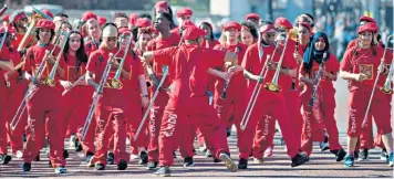  ??  ?? The Kinetika Bloco youth group perform in The Mall, while Meghan Markle attends a Commonweal­th Youth Forum women’s empowermen­t event at the Royal Aeronautic­al Society