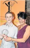  ?? 300317spor­ts award_03 ?? Future star Gymnast Alex Morgan receives his junior male of the year gong from sports council chairwoman Liz Arbuckle