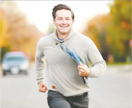  ?? JULIE OLIVER ?? In Carleton riding, Conservati­ve candidate Pierre Poilievre was sprinting around Stittsvill­e to get out the vote on election day. The career politician says he was taking nothing for granted, hitting as many doors as he could fit in until around 9 p.m. on Monday.