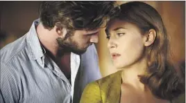  ?? Broad Green Films ?? LIAM HEMSWORTH and Kate Winslet share an attraction in “The Dressmaker,” the film adaptation of Rosalie Ham’s bestsellin­g book.