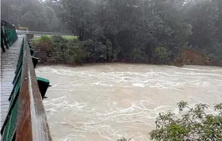  ?? SUPPLIED ?? The flooded Te Hoiere/Pelorus River was almost up to the bridge deck at Pelorus Bridge Scenic Reserve.