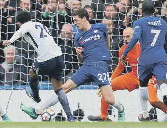  ??  ?? Dele Alli hits home Spurs’ third goal in yesterday’s impressive 3-1 victory at Chelsea.