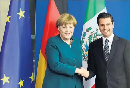  ?? Tobias Schwarz AFP/Getty Images ?? GERMAN Chancellor Angela Merkel and Mexican President Enrique Peña Nieto in Berlin in 2016. Her visit to Mexico begins Friday.