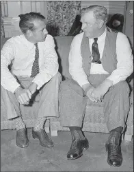  ?? (File Photo/AP) ?? Actor Gary Cooper (left) who played the title role in the movie “Sergeant York,” talks in July 1941 with Sgt. Alvin York, on whose life the movie was based, at a New York hotel.
