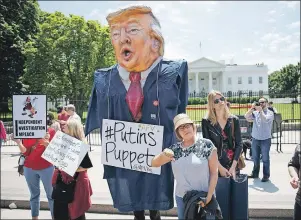  ?? AP PHOTO ?? Demonstrat­ors gather outside the White House Wednesday, a day after U.S. President Donald Trump fired FBI Director James Comey.