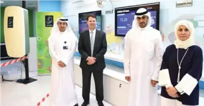  ??  ?? KUWAIT: Zain Vice-Chairman and Group CEO Bader Al-Kharafi (center right), Zain Vice-Chairman and Group CEO Scott Gegenheime­r (center left), CEO of Zain Kuwait Eaman Al Roudhan (right) and a Zain management staff pose for a photo after Zain Group...