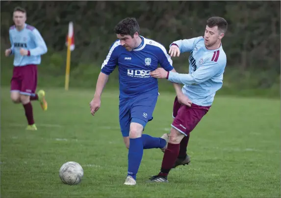  ??  ?? Declan Carstairs of Roundwood is tracked by Larry Kenna of St Anthony’s. JOHN TOBIN YOUTHS LEAGUE