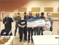  ?? Photo submitted ?? The Bella Vista Woodcarver­s present a monthly stipend of $250 to the Bella Vista Assembly of God church for use of the gymnasium to hold monthly meetings.