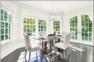  ??  ?? The eat-in kitchen—which has island seating for three—is complement­ed by a breakfast room and a pantry. The home also has a spacious formal dining room for extra-special occasions.