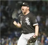  ?? BRIAN CASSELLA/CHICAGO TRIBUNE ?? White Sox closer Liam Hendriks celebrates getting the save in a win over the Cubs on May 4 at Wrigley Field.