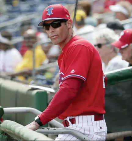  ?? LYNNE SLADKY — THE ASSOCIATED PRESS FILE ?? Phillies manager Gabe Kapler watches from the dugout before a spring training game against the New York Yankees, in Clearwater, Fla. Kapler plans to do some unconventi­onal things, like flip-flop outfielder­s in the middle of an inning to put his best...