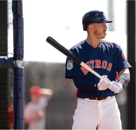  ?? Karen Warren / Houston Chronicle ?? Astros shortstop Carlos Correa is making adjustment­s to his stance during spring training. “I don’t want (my elbow) to be above my shoulder,” he said. “I want it to be level in order for me to stay behind the ball and drive it.”