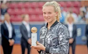  ?? Reuters ?? Katerina Siniakova of the Czech Republic poses with the trophy after beating Caroline Wozniacki of Denmark in their women’s singles final match at the Swedish Open. —