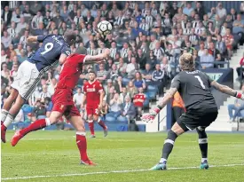  ??  ?? West Brom’s Salomon Rondon, left, scores their second goal against Liverpool.