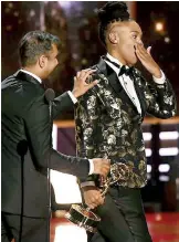  ??  ?? Aziz Ansari and Lena Waithe accept their award for best writing for a comedy series for Master of None. Shuttersto­ck