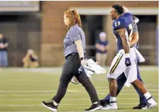  ?? STAFF PHOTO BY C.B. SCHMELTER ?? UTC running back Tyrell Price is helped off the field during a home game against Eastern Illinois on Aug. 29, 2019. Health could be a concern for the Mocs at running back this year, with three of their top options at the position coming off injuries that shortened their 2019 seasons.