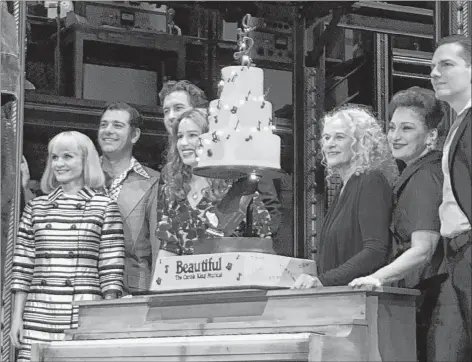  ?? AP PHOTO ?? Carole King, third from right, poses for photos with the cast of “Beautiful: The Carole King Musical” at the Stephen Sondheim Theatre after a performanc­e in New York on Saturday.