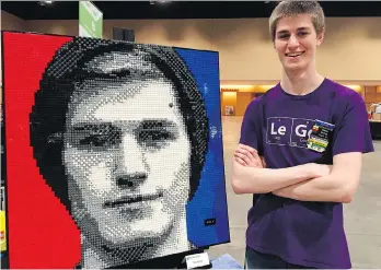  ?? MARCIA DUNN/THE ASSOCIATED PRESS ?? College student Casey McCoy displays the self-portrait he created from more than 3,000 Lego bricks. McCoy will be among the thousands of attendees at Brickworld Chicago.