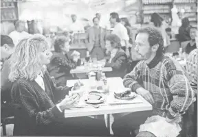 ?? ANDY SCHWARTZ, CASTLE ROCK ENTERTAINM­ENT ?? Meg Ryan, Billy Crystal and a famous deli scene set the standard for romantic comedies in Ephron’s When Harry Met Sally.