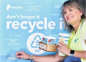  ?? PHOTOS: PETER MCINTOSH ?? Recycling polypropyl­ene . . . Dunedin firm Packit Packaging sales director Jan Swann at yesterday’s launch of a city trial to recycle number 5 plastics: light, rigid plastic containers for ice cream and other foods.