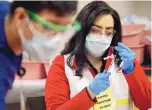  ?? ADOLPHE PIERRE-LOUIS/JOURNAL ?? University of New Mexico COVID-19 vaccine clinic head Gianna Chavez during the first day of the vaccinatio­n clinic at The Pit on Jan. 20. The clinic will take a “pause” while awaiting additional vaccine supplies.