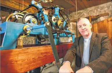  ?? Picture: Alan Langley FM4934847 ?? The Rev John MacKenzie winding the Victorian clock at St Mary’s Church in Willesboro­ugh