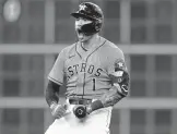  ?? DAVID J. PHILLIP/AP ?? Astros shortstop Carlos Correa celebrates after hitting a two-run double against the White Sox during Game 2 of the ALDS on Friday in Houston.