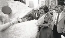  ?? Steve Ringman / The Chronicle 1982 ?? S.F. Mayor Dianne Feinstein meets Pac-Man at a ceremony marking Atari’s donation to the Save the Cable Cars fund.