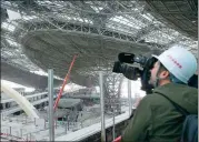  ?? WANG ZHUANGFEI / CHINA DAILY ?? Reporters visit Beijing’s new internatio­nal airport, under constructi­on in Daxing district, on Friday. The airport, the third civil airport in Beijing, is scheduled to be completed on June 30 and to open on Sept 30.