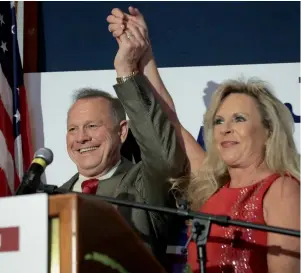  ?? AFP ?? Roy Moore and his wife Kayla greet supporters at an election rally in Montgomery, Alabama. —