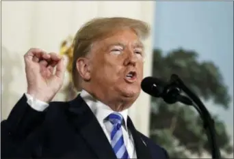  ?? EVAN VUCCI — THE ASSOCIATED PRESS ?? President Donald Trump delivers a statement on the Iran nuclear Reception Room of the White House, Tuesday in Washington. deal from the Diplomatic