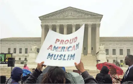  ??  ?? Seema Sked, 39, of Richmond, Va., demonstrat­es Wednesday outside the Supreme Court in Washington.