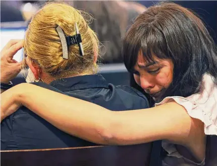  ?? Photos by Jerry Lara/staff photograph­er ?? Family members of victims react as crime scene photos are shown on the second day in Juan David Ortiz’s capital murder trial.