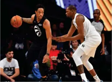  ??  ?? TEAM Stephen guard DeMar DeRozan of the Toronto Raptors (10) moves the ball against Team LeBron forward Kevin Durant of the Golden State Warriors (35) during the second half of the 2018 NBA All Star Game at Staples Center. Reuters