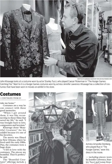  ?? PHOTOS BY BARBARA HADDOCK TAYLOR/BALTIMORE SUN ?? John Klisavage looks at a costume worn by actor Stanley Tucci, who played Caesar Flickerman in “The Hunger Games: Catching Fire.” Next to it is a Hunger Games costume worn by actress Jennifer Lawrence. Klisavage has a collection of costumes that have...