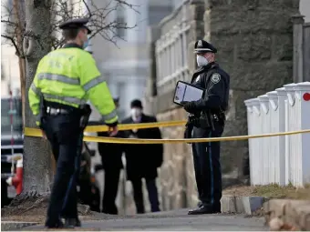  ?? MATT STONE PHOTOS / HERALD STAFF ?? ALLEGEDLY CHARGED OFFICERS: Police investigat­e at a home on Otis Street in Wakefield, where police shot a 23-year-old man during an investigat­ion into the death of a woman inside.