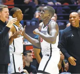  ?? K.C. ALFRED U-T ?? Aguek Arop comes off the floor against Boise State on Friday, happy that the Aztecs had secured a win. But more is left to be done with three big games on tap.