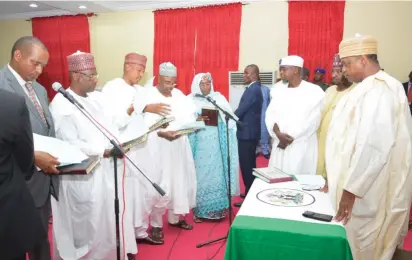  ??  ?? Newly appointed commission­ers take their oath of office before Gov. Ibrahim Gaidam of Yobe State (right), at the Government House in Damaturu yesterday.