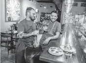  ?? PEDRO PORTAL pportal@miamiheral­d.com ?? Chefs Evan Burgess and Osmel Gonzalez at EntreNos in Miami Shores, which operates in the Tinta y Cafe space four nights a week. The restaurant, which strives to source ingredient­s from Florida, was just named to the 2024 Michelin Guide.