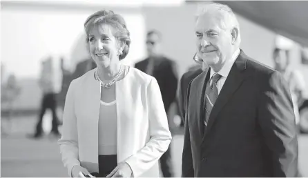  ?? AP-Yonhap ?? U.S. Secretary of State Rex Tillerson is welcomed by U.S. Ambassador Roberta Jacobson as he arrives at Benito Juarez internatio­nal Airport in Mexico City, Wednesday.