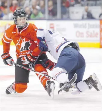  ?? ERNEST DOROSZUK ?? Canadian forward Meghan Agosta of Ruthven, left, battles Team USA’s Jocelyne Lamoureux in a recent friendly series and will seek her fourth Olympic tournament gold medal in February.