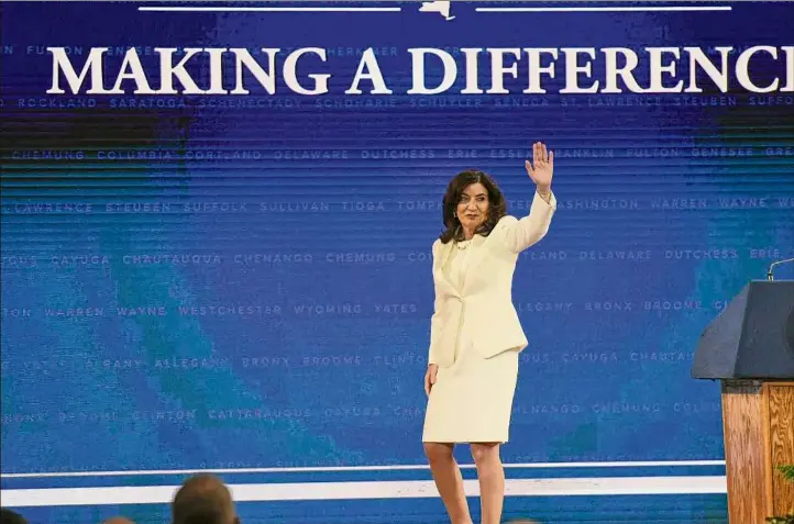  ?? Will Waldron / Times Union ?? Gov. Kathy Hochul acknowledg­es the crowd Jan. 1 after being sworn in to her first full term as the 57th governor of New York at the Empire State Plaza Convention Center in Albany.