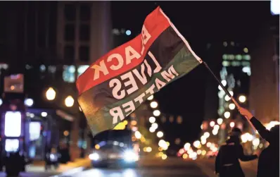  ?? PHOTOS BY KYLE ROBERTSON/COLUMBUS DISPATCH ?? Protesters who gathered Wednesday evening for what they called a “Stop the Lies” protest move along South High Street in Downtown Columbus.