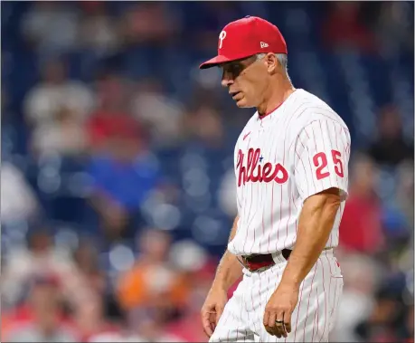  ?? MATT SLOCUM — THE ASSOCIATED PRESS ?? It seems that Phillies manager Joe Girardi’s head has been bowed more often than not lately. Such is the life of the leader of an underachie­ving team.