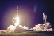  ?? JOHN RAOUX/ASSOCIATED PRESS ?? A SpaceX Falcon 9 rocket with the Crew Dragon space capsule lifts off Friday from pad 39A at the Kennedy Space Center in Cape Canaveral, Fla.