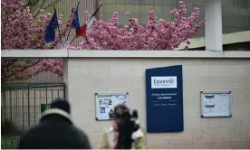  ?? Photograph: Miguel Medina/AFP/Getty Images ?? A TV crew films outside Les Sablons middle school in Viry-Châtillon, where a teenage boy was assaulted on Thursday.