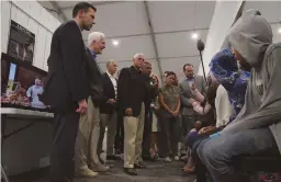  ?? (Veronica G. Cardenas/Reuters) ?? US VICE PRESIDENT Mike Pence talks to asylum-seekers in Donna, Texas, on Friday.