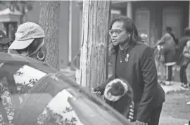  ?? JERRY HABRAKEN/DELAWARE NEWS JOURNAL ?? Delaware State Rep. Sherry Dorsey Walker speaks with displaced residents on North Adams Street on May 16, 2022.