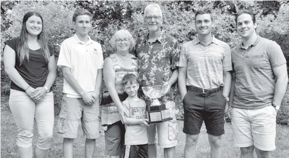  ?? [WHITNEY NEILSON / THE OBSERVER] ?? Lu Ann and Graham Snyder, along with grandson Reed Snyder, presented the Dan Snyder Memorial Scholarshi­p in memory of their son to four deserving scholars on Tuesday night at their home: Cassandra Tuffnail, Tyler Moser, Zac Coulter and Rob Kohli.