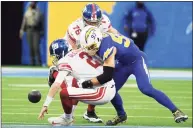  ?? Kevork Djansezian / Getty Images ?? The Chargers’ Joey Bosa sacks Giants quarterbac­k Mike Glennon causing a fumble and turnover on Sunday.